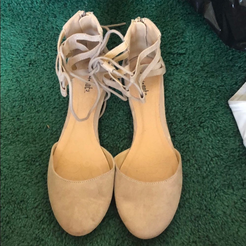 Lace up flats.
